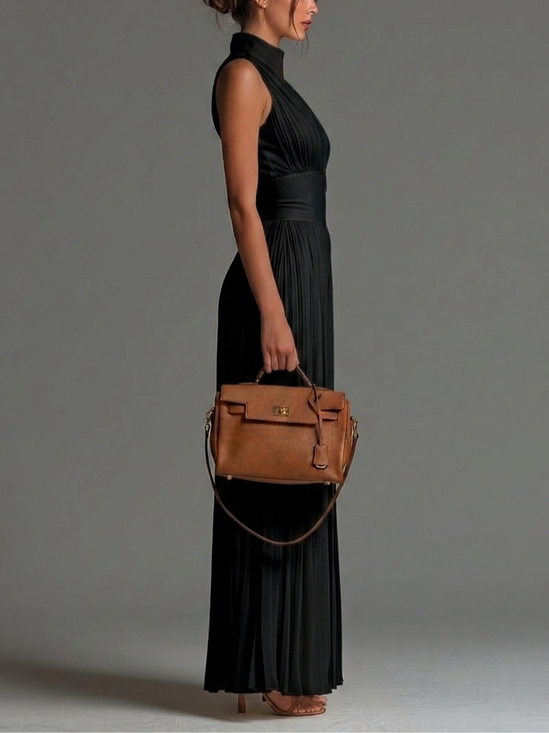 Mono de chiffon negro sin mangas con cuello en V y cremallera, plisado y de pierna ancha